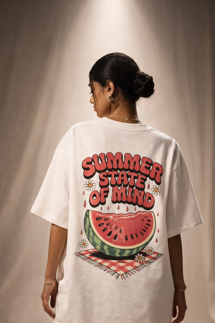 Person wearing a white oversized t-shirt with 'Summer State of Mind' graphic on the back.