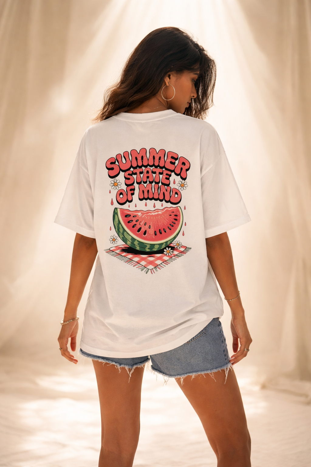 Person wearing a white t-shirt with a watermelon graphic and 'Summer State of Mind' text.
